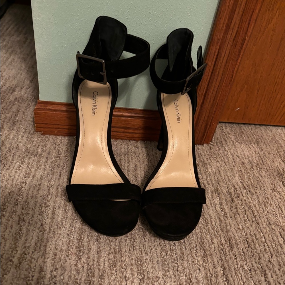 Calvin Klein high heels with buckle straps. Some wear on heels, see photos.